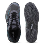 Gray and black athletic shoe with blue accents, showing top and sole views on a white background.