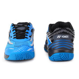 Blue athletic shoes with black soles on a white background, featuring the Yonex brand.